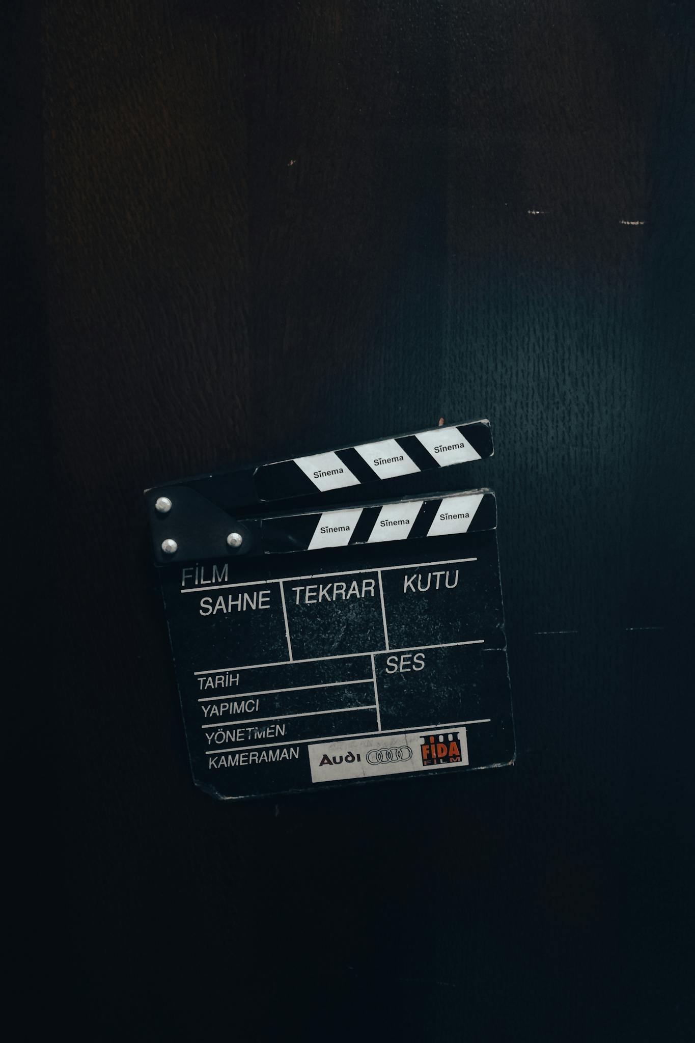Film clapperboard against a dark backdrop, representing filmmaking in Istanbul, Türkiye.