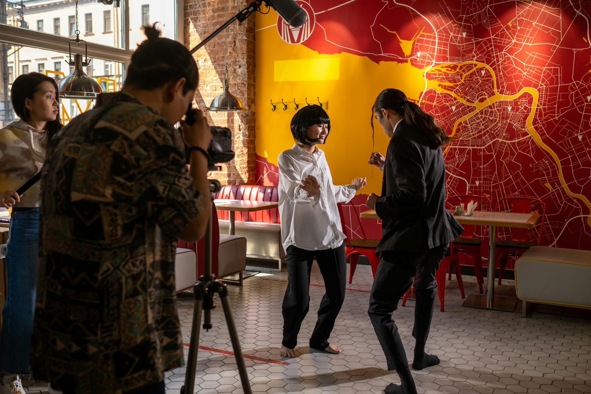 Filmmaking scene in a lively café, capturing actors and crew in creative action.
